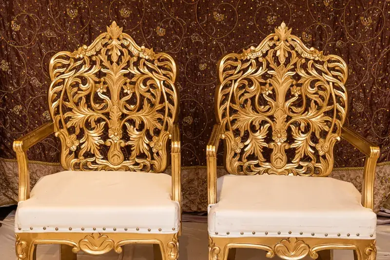 Carved gold seats of the Shreya Mandap