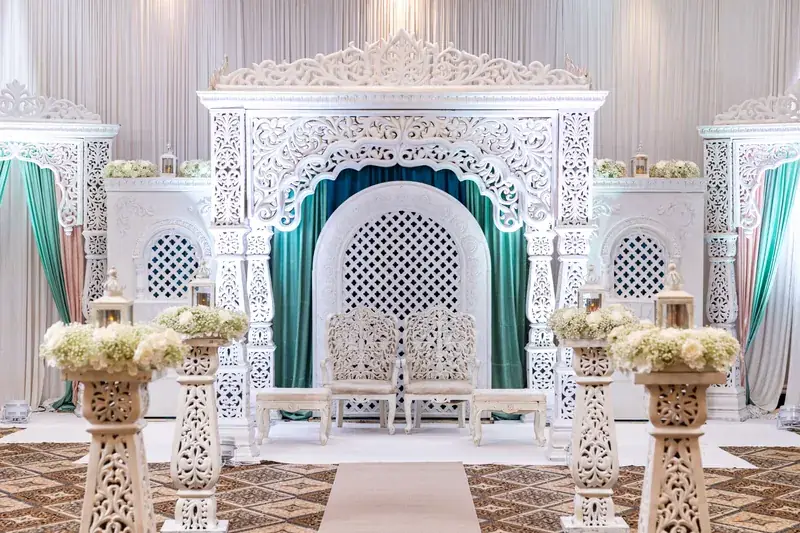 Jodha Akbar Mandap: white jali mandap with teal drapes