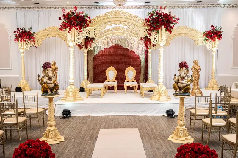 Rangeela Mandap: full stage with gold elephants and red florals